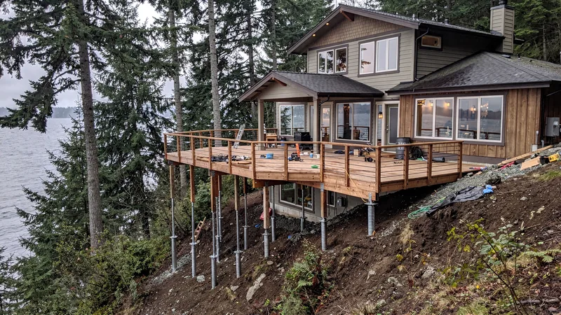 Helical pier installation for a hillside home in Gig Harbor, WA